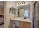 The bathroom has a large mirror over the vanity, with a view of the bedroom and walk-in shower at 338 Oak Leaf Pl, Acworth, GA 30102