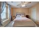 Comfortable bedroom features soft carpet, ceiling fan, light-colored walls, and neutral accents at 338 Oak Leaf Pl, Acworth, GA 30102