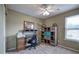 Bedroom with a ceiling fan, work space, and built in storage, all featuring neutral colors at 338 Oak Leaf Pl, Acworth, GA 30102
