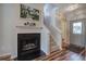 Inviting entryway featuring stairs, fireplace, and doorway providing a warm welcome at 338 Oak Leaf Pl, Acworth, GA 30102