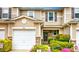 Inviting townhouse exterior with a one car garage, well-maintained landscaping, and charming curb appeal at 338 Oak Leaf Pl, Acworth, GA 30102