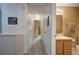Hallway with access to the bathroom and bedrooms, featuring neutral wall colors at 338 Oak Leaf Pl, Acworth, GA 30102