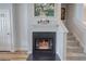 Interior view of a fireplace in a home with neutral tones and hardwood flooring at 338 Oak Leaf Pl, Acworth, GA 30102