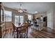 Bright kitchen with island, stainless steel appliances, hardwood floors and access to the backyard at 338 Oak Leaf Pl, Acworth, GA 30102