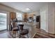 Bright kitchen with island, stainless steel appliances, hardwood floors and access to the backyard at 338 Oak Leaf Pl, Acworth, GA 30102
