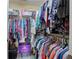 Spacious walk-in closet with ample hanging space, shelving, and a Crown Royal box at 338 Oak Leaf Pl, Acworth, GA 30102