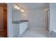 Bathroom featuring a double vanity with granite countertops, white cabinets, and a tiled shower at 4265 Easter Lily Ave, Buford, GA 30519