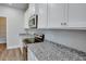 Bright kitchen featuring stainless steel appliances, white cabinets, and granite countertops at 4265 Easter Lily Ave, Buford, GA 30519