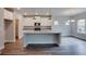 Modern kitchen with granite countertops, stainless steel appliances, and a spacious island at 4265 Easter Lily Ave, Buford, GA 30519