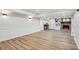 Basement showcasing an open living space with modern flooring and updated wainscoting at 6124 Kings Mountain Ct, Stone Mountain, GA 30087