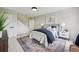 Cozy bedroom with accent rug and white nightstands at 6124 Kings Mountain Ct, Stone Mountain, GA 30087