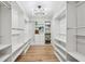 Spacious walk-in closet with custom shelving and ample storage space at 6124 Kings Mountain Ct, Stone Mountain, GA 30087