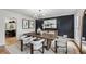 Elegant dining room with stylish decor, modern chandelier, and sophisticated accents creates a perfect entertaining space at 6124 Kings Mountain Ct, Stone Mountain, GA 30087