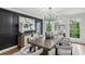 Sophisticated dining room featuring dark accent wall, modern chandelier, and elegant furnishings for refined gatherings at 6124 Kings Mountain Ct, Stone Mountain, GA 30087