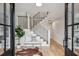 Elegant foyer with hardwood floors, staircase, decorative bench, and stylish accents offers a grand entrance at 6124 Kings Mountain Ct, Stone Mountain, GA 30087