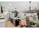 Spacious kitchen with a large island, stainless steel appliances, and an open layout to the dining and living areas at 6124 Kings Mountain Ct, Stone Mountain, GA 30087