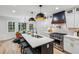 Bright, eat-in kitchen with a large island, stainless steel appliances, and modern finishes at 6124 Kings Mountain Ct, Stone Mountain, GA 30087