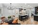 Modern kitchen with black and white cabinetry, stainless steel appliances, and a stylish breakfast nook at 6124 Kings Mountain Ct, Stone Mountain, GA 30087
