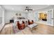 Open, light-filled main bedroom with hardwood floors, sitting area, and access to main bath at 6124 Kings Mountain Ct, Stone Mountain, GA 30087