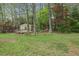 Cozy outbuilding with a small deck, nestled amongst trees, providing a private and tranquil space at 6124 Kings Mountain Ct, Stone Mountain, GA 30087