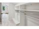 Walk-in closet with built-in shelving and a view of the bedroom with a seating area at 6124 Kings Mountain Ct, Stone Mountain, GA 30087