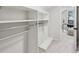 Walk-in closet with shelving and a view into the office space at 6124 Kings Mountain Ct, Stone Mountain, GA 30087