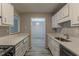 Long kitchen featuring stainless steel appliances, ample counter space, and a pass through at 104 Natchez Trce, Atlanta, GA 30350