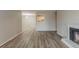 Bright living room featuring an open concept design, fireplace and modern flooring at 104 Natchez Trce, Atlanta, GA 30350
