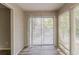 Bright living room featuring sliding glass doors, neutral walls, and modern flooring at 104 Natchez Trce, Atlanta, GA 30350