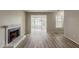 Bright living room with fireplace and view to screened porch with lots of natural light at 104 Natchez Trce, Atlanta, GA 30350