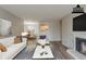 Living room showcasing a fireplace, open-concept design, and virtually staged decor at 104 Natchez Trce, Atlanta, GA 30350