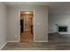 Living room showcasing open design with view to kitchen and fireplace at 104 Natchez Trce, Atlanta, GA 30350