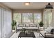 Virtually staged sun room with lots of natural light and views to backyard at 104 Natchez Trce, Atlanta, GA 30350