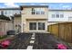 Exterior view of the backyard featuring a wooden fence and sliding glass doors at 10900 Wittenridge Dr # D5, Alpharetta, GA 30022
