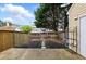 Exterior view of the backyard featuring a wooden fence and a concrete patio at 10900 Wittenridge Dr # D5, Alpharetta, GA 30022