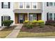 Charming home exterior featuring a brick facade, dark shutters and a landscaped yard at 10900 Wittenridge Dr # D5, Alpharetta, GA 30022