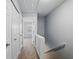 Hallway view with closet doors and an open view to the bedroom at 10900 Wittenridge Dr # D5, Alpharetta, GA 30022