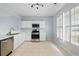 Bright kitchen featuring white cabinets, stainless steel appliances, and tile flooring at 10900 Wittenridge Dr # D5, Alpharetta, GA 30022