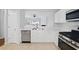 Well-lit kitchen featuring stainless steel appliances and a functional layout at 10900 Wittenridge Dr # D5, Alpharetta, GA 30022