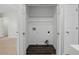 A dedicated laundry closet with washer and dryer hookups and wood flooring at 10900 Wittenridge Dr # D5, Alpharetta, GA 30022