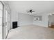 Spacious living room featuring a fireplace and sliding glass doors to the outside at 10900 Wittenridge Dr # D5, Alpharetta, GA 30022