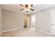 Bedroom with ceiling fan shows access to a bathroom at 1207 Mcclelen Way, Decatur, GA 30033