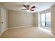Bright bedroom boasts large windows and neutral carpeting at 1207 Mcclelen Way, Decatur, GA 30033