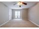Spacious carpeted bedroom has a ceiling fan and natural light at 1207 Mcclelen Way, Decatur, GA 30033