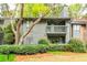 Exterior of condo with balcony overlooks manicured landscaping at 1207 Mcclelen Way, Decatur, GA 30033
