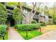 Charming condo exterior features lush landscaping and inviting walkways at 1207 Mcclelen Way, Decatur, GA 30033