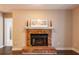 Charming brick fireplace is the focal point of the living room at 1207 Mcclelen Way, Decatur, GA 30033