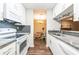 Bright kitchen with granite countertops, stainless appliances, and open layout to the dining area at 1207 Mcclelen Way, Decatur, GA 30033