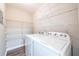 Functional laundry room with ample shelving and modern washer and dryer at 1207 Mcclelen Way, Decatur, GA 30033