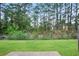 Large backyard with lawn and wooden fence at 3116 Fields Dr, Lithonia, GA 30038